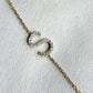 Gold necklace with a letter S made from cubic zirconia crystals